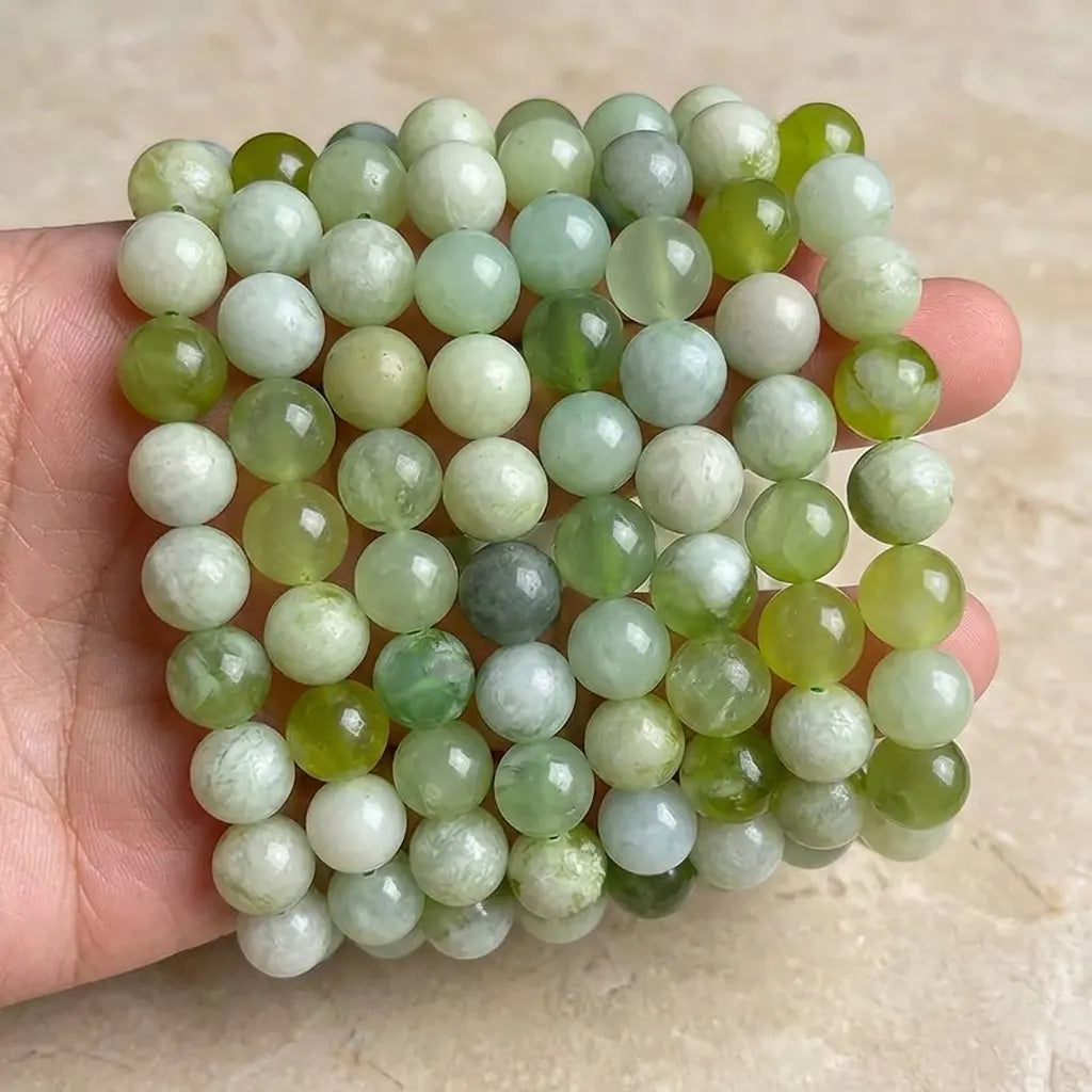 Light green natural jade strand beads - 4mm to 10mm