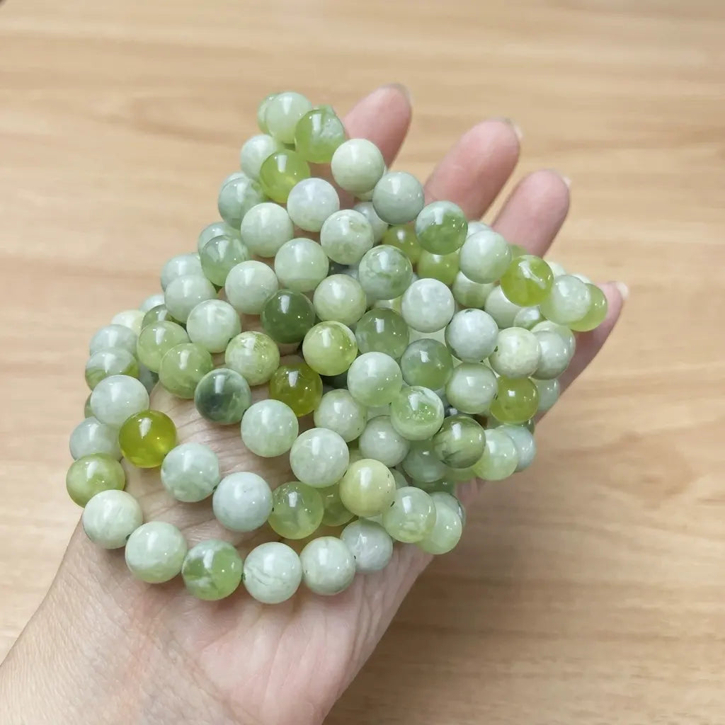 Light green natural jade strand beads - 4mm to 10mm